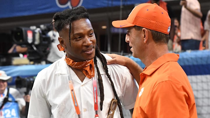 Aug 31, 2024; Atlanta, Georgia, USA; Former Clemson Tigers wide receiver DeAndre Hopkins smiles with head coach Dabo Swinney before the 2024 Aflac Kickoff Game with the University of Georgia Bulldogs at Mercedes-Benz Stadium