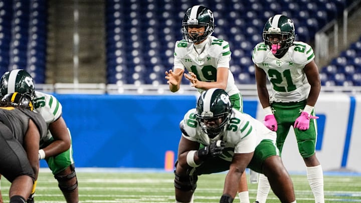 Detroit Cass Tech freshman quarterback Donald Tabron II calls for a snap as guard Jestin Wilson (50) prepares to block against Detroit King during the first half of PSL championship at Ford Field in Detroit on Friday, Oct. 18, 2024.