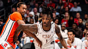 Florida State Seminoles forward Jamir Watkins (1) drives the ball against the Syracuse Orange in the 2025 ACC Tournament in Charlotte, North Carolina
