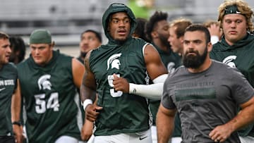 Michigan State's Jordan Hall, center, and the rest of the Spartans head back to the locker room before the game against Florida Atlantic on Friday, Aug. 30, 2024, at Spartan Stadium in East Lansing.