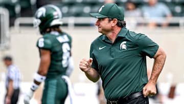Michigan State's head coach Jonathan Smith jogs back to the sideline before the game against Youngstown State on Saturday, Sept. 13, 2025, at Spartan Stadium in East Lansing.