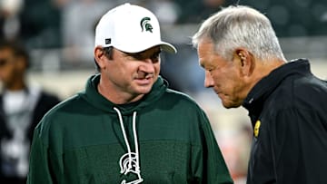 Michigan State head coach Jonathan Smith talks with Iowa head coach Kirk Ferentz before the game Saturday, Oct. 19, 2024, at Spartan Stadium in East Lansing.