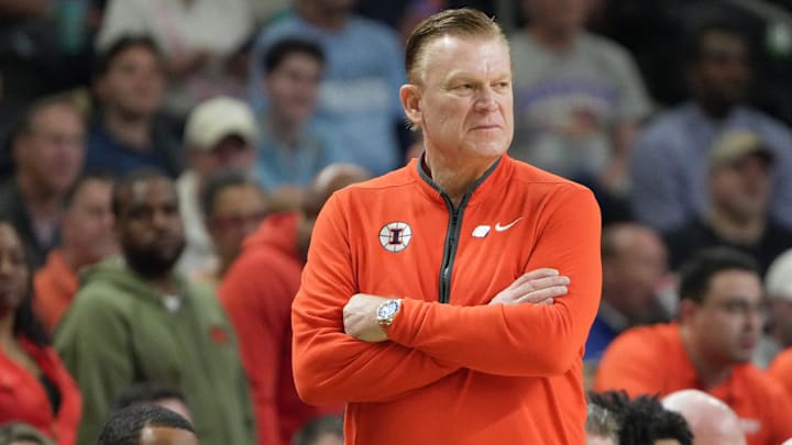 Illinois Fighting Illini head coach Brad Underwood watches as his team plays March 21, 2026 during the first half of the NCAA Men’s Basketball Tournament second round game against VCU at the Bon Secours Wellness Arena in Greenville, South Carolina.