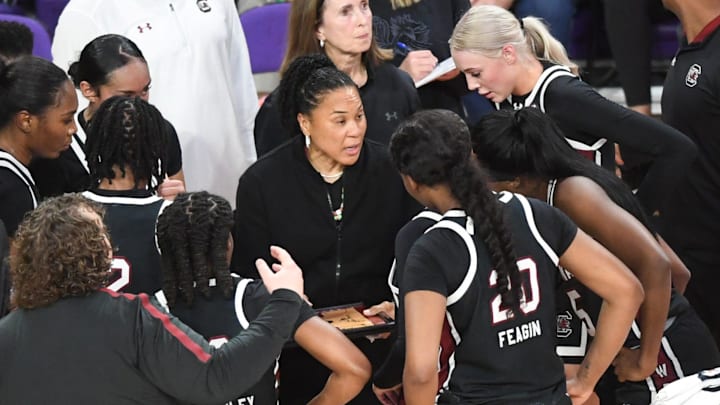 South Carolina Coach Dawn Staley talks with players in a break from playing Clemson during the second quarter at Littlejohn Coliseum Wednesday, Nov. 20, 2024 in Clemson, SC.