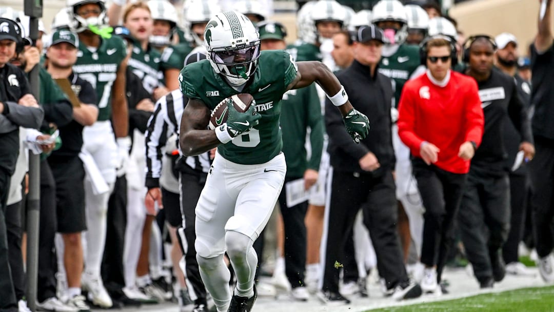 Michigan State's Nick Marsh, left, runs after a catch against UCLA during the first quarter on Saturday, Oct. 11, 2025, at Spartan Stadium in East Lansing. Michigan State's Nick Marsh, left, runs after a catch against UCLA during the first quarter on Saturday, Oct. 11, 2025, at Spartan Stadium in East Lansing.