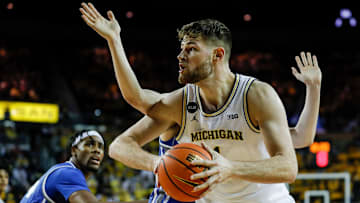 Michigan center Hunter Dickinson (1) goes to the basket against Buffalo during the second half at