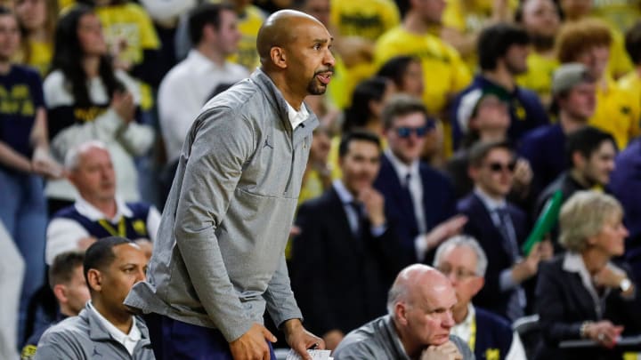 Michigan assistant coach Saddi Washington watches a plat against Toledo during the second half of the first round of the NIT at Crisler Center in Ann Arbor on Tuesday, March 14, 2023.