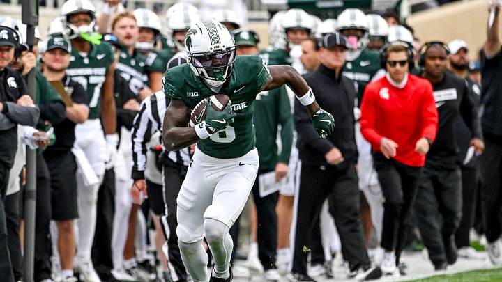 Michigan State's Nick Marsh, left, runs after a catch against UCLA during the first quarter on Saturday, Oct. 11, 2025, at Spartan Stadium in East Lansing.