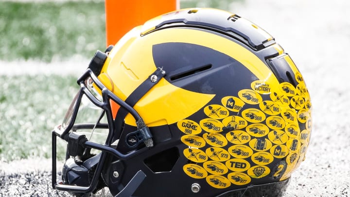 Michigan running back Blake Corum's helmet sits on the turf during warmups before the Ohio State game at Michigan Stadium in Ann Arbor on Saturday, Nov. 25, 2023.