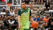 Team Faygo and Michigan State's Divine Ugochukwu moves the ball against Team Motorcars during the Moneyball Pro-Am on Tuesday, June 24, 2025, at Holt High School.
