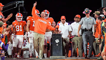 Clemson head coach Dabo Swinney points up while rubbing Howard's Rock, before he runs down the hill with the team before the game at Memorial Stadium in Clemson, South Carolina Saturday, October 1, 2022.

Ncaa Football Clemson Football Vs Nc State Wolfpack