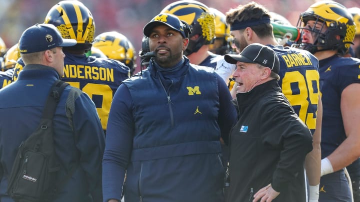 Michigan acting head coach and offensive coordinator Sherrone Moore watches a replay during the first half against Ohio State at Michigan Stadium in Ann Arbor on Saturday, Nov. 25, 2023.