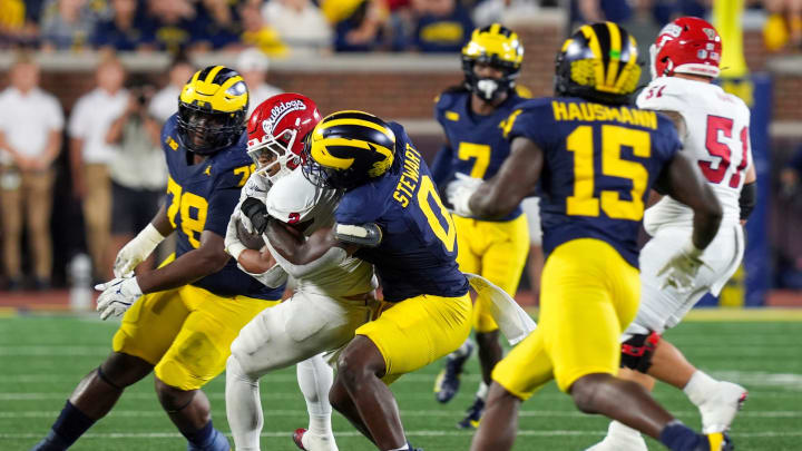 Michigan edge rusher Josaiah Stewart (0) tackles Fresno State running back Malik Sherrod (2) during the second half at Michigan Stadium in Ann Arbor on Saturday, Aug. 31, 2024.