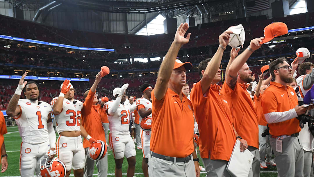 Aug 31, 2024; Atlanta, Georgia, USA; Clemson Tigers head coach Dabo Swinney joins the team in the alma mater after the 2024 Aflac Kickoff Game against the Georgia Bulldogs at Mercedes-Benz Stadium.