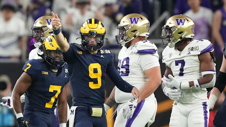 Michigan quarterback J.J. McCarthy points down the field during the second half of the College Football Playoff national championship game against Washington at NRG Stadium in Houston, Texas on Monday, Jan. 8, 2024.