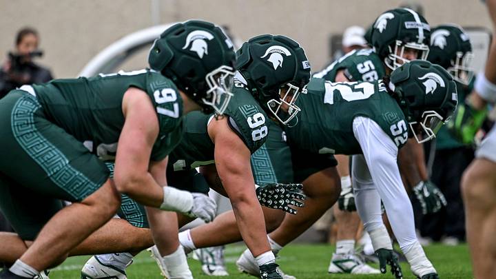 Michigan State's Derrick Simmons, center, lines up with the defense during the football Spring Showcase on Saturday, April 18, 2026, at Spartan Stadium in East Lansing.