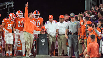 Clemson head coach Dabo Swinney points up while rubbing Howard's Rock, before he runs down the hill with the team before the game at Memorial Stadium in Clemson, South Carolina Saturday, October 1, 2022.

Ncaa Football Clemson Football Vs Nc State Wolfpack