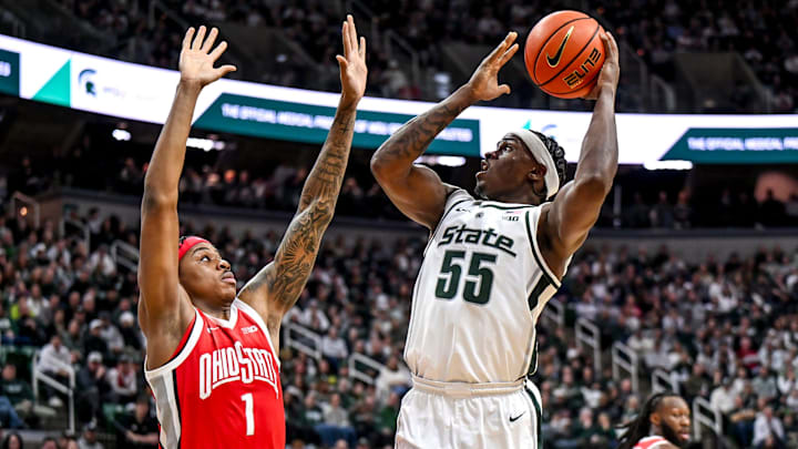 Michigan State's Coen Carr, right, shoots as Ohio State's Amare Bynum defends during the first half on Sunday, Feb. 22, 2026, at the Breslin Center in East Lansing.