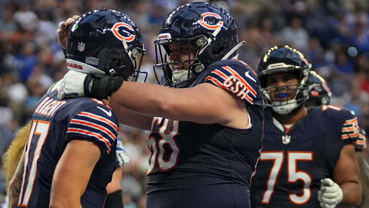 Center Doug Kramer (68) celebrates with QB Tyson Bagent after a touchdown in Bears preseason.