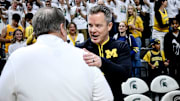 Michigan State's head coach Tom Izzo, left, and Michigan's head coach Dusty May shake hands before the game on Sunday, March 9, 2025, at the Breslin Center in East Lansing.