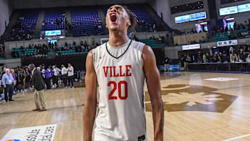 South Carolina basketball commitment Hayden Assemian celebrating his state championship win for Powdersville High School