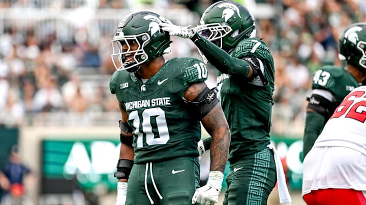 Michigan State's Wayne Matthews III, left, celebrates with Nikai Martinez after a tackle against Youngstown State during the third quarter on Saturday, Sept. 13, 2025, at Spartan Stadium in East Lansing.