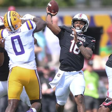 South Carolina quarterback LaNorris Sellers (16) passes near Louisiana State University defensive end Paris Shand (0) during the first quarter at Williams-Brice Stadium in Columbia, S.C. Saturday, September 14, 2024.