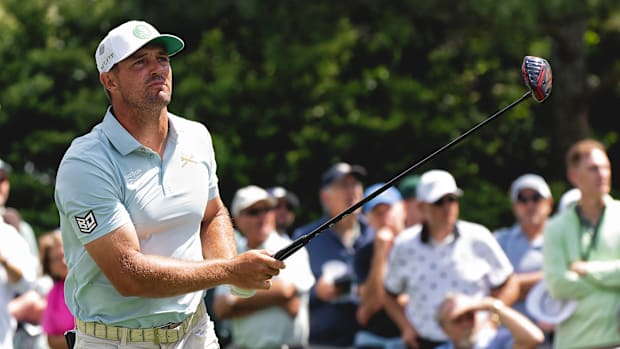 Bryson DeChambeau looks on after a drive.