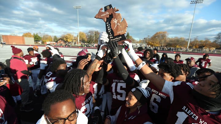 Harper Woods players celebrate the 46-19 playoff win against Airport High School at Harper Woods High School on Saturday, Nov 11, 2023.