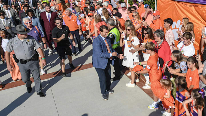 Sep 21, 2024; Clemson, South Carolina, USA; Clemson Tigers head coach Dabo Swinney greets fans at Tiger Walk outside Memorial Stadium before a game between the Clemson Tigers and the North Carolina State Wolfpack. Mandatory Credit: Ken Ruinard-Imagn Images