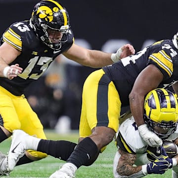 Michigan running back Blake Corum runs against Iowa defensive back Xavier Nwankpa (1) during the second half of U-M's 26-0 win over Iowa in the Big Ten championship game in Indianapolis on Saturday, Dec. 2, 2023.