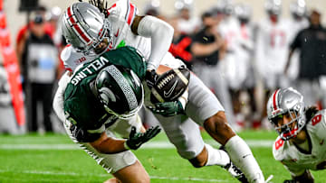 Michigan State's Jack Velling, left, has the ball stripped by Ohio State's Jordan Hancock during the second quarter on Saturday, Sept. 28, 2024, at Spartan Stadium in East Lansing.