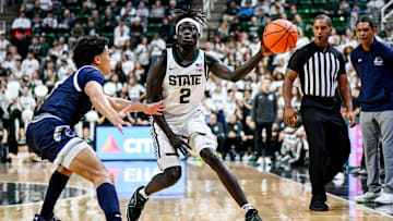 Michigan State's Kur Teng, right, passes the ball against Monmouth during the first half on Monday, Nov. 4, 2024, at the Breslin Center in East Lansing.