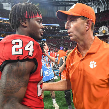 Aug 31, 2024; Atlanta, Georgia, USA; Clemson Tigers head coach Dabo Swinney greets Georgia Bulldogs defensive back Malkai Starks (24) after the 2024 Aflac Kickoff Game at Mercedes-Benz Stadium. 