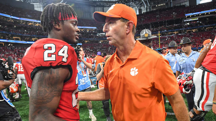 Aug 31, 2024; Atlanta, Georgia, USA; Clemson Tigers head coach Dabo Swinney greets Georgia Bulldogs defensive back Malkai Starks (24) after the 2024 Aflac Kickoff Game at Mercedes-Benz Stadium. 