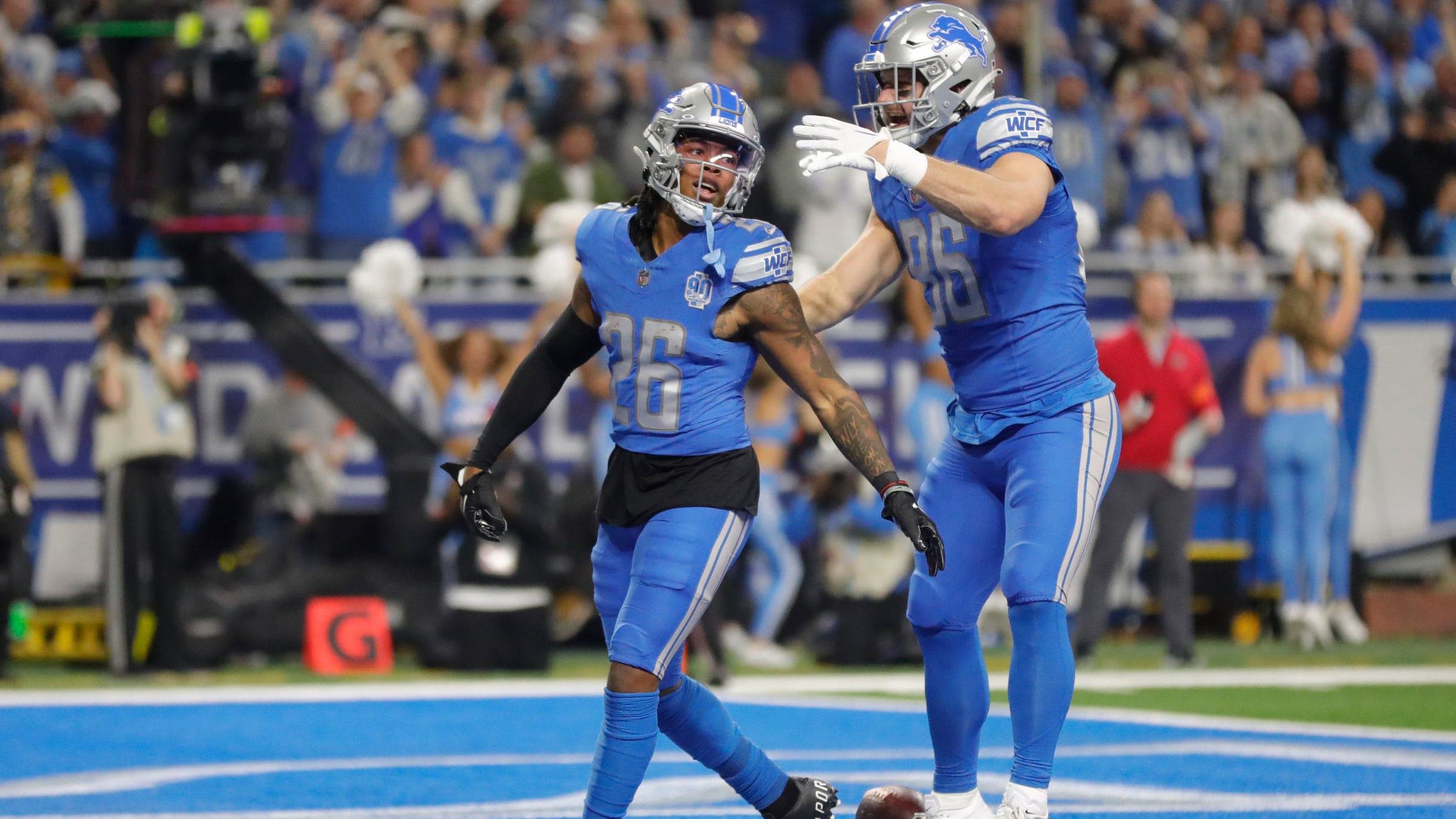 Detroit Lions running back Jahmyr Gibbs celebrates a touchdown with Detroit Lions tight end Anthony Firkser.