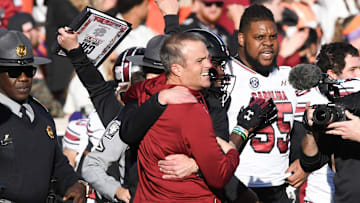 Nov 30, 2024; Clemson, South Carolina, USA; Clemson head coach Dabo Swinney and South Carolina Head Coach Shane Beamer talk after the game at Memorial Stadium. Mandatory Credit: Ken Ruinard-Imagn Images