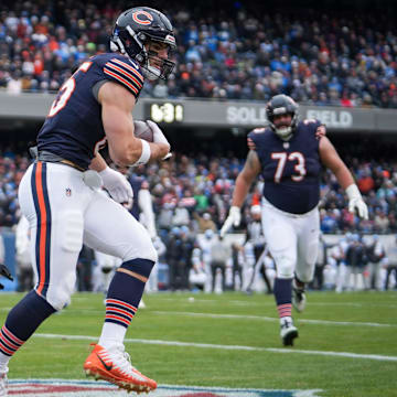 Cole Kmet hauls in a touchdown pass against the Lions last season. 