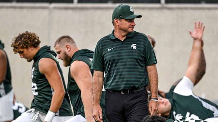 Michigan State's head coach Jonathan Smith looks on during team warm ups before the game against Florida Atlantic on Friday, Aug. 30, 2024, at Spartan Stadium in East Lansing.