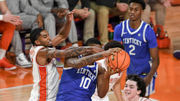 Dec 3, 2024; Clemson, South Carolina, USA; Kentucky forward Brandon Garrison (10) rebounds near Clemson guard Dillon Hunter (2) during the first half at Littlejohn Coliseum. Mandatory Credit: Ken Ruinard-Imagn Images