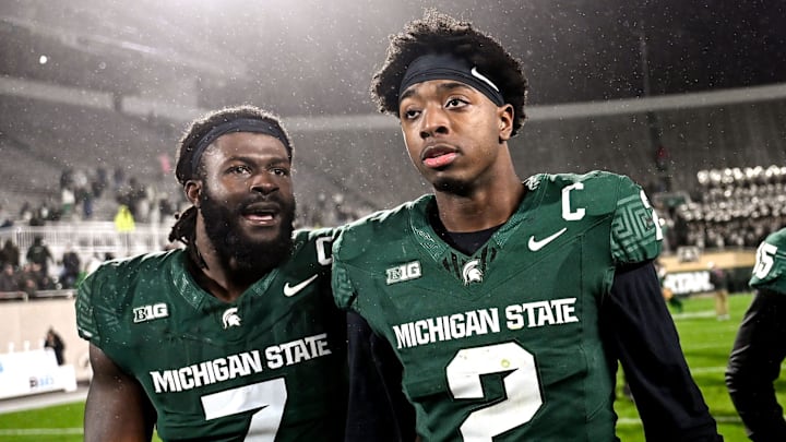 Michigan State's Jordan Turner, left, talks with Aidan Chiles as they head to the locker room after defeating Purdue on Friday, Nov. 22, 2024, at Spartan Stadium in East Lansing.
