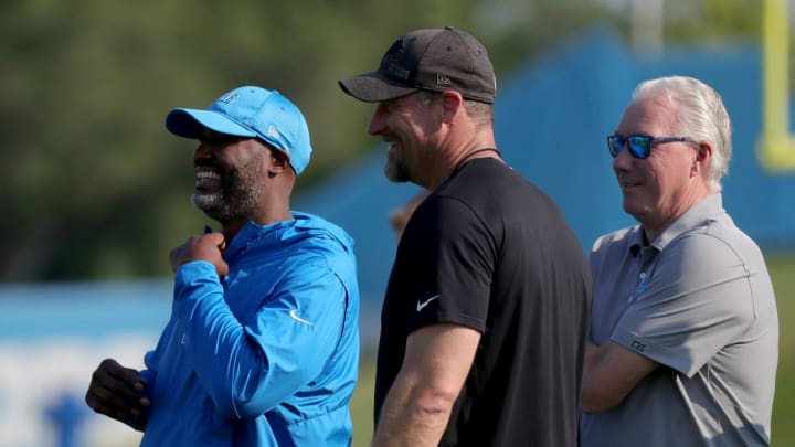 Detroit Lions GM Brad Holmes, head coach Dan Campbell and Team President CEO Rod Wood talk during training camp 