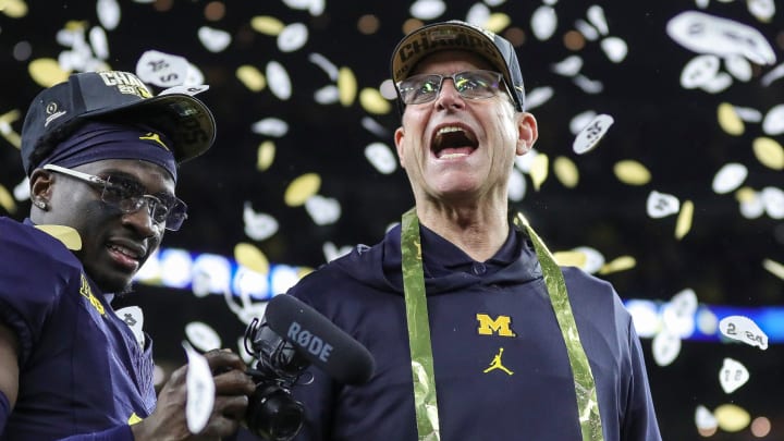 Michigan head coach Jim Harbaugh celebrates during the trophy presentation after the 34-13 win over Washington at the national championship game at NRG Stadium in Houston on Monday, Jan. 8, 2024.