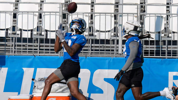 Detroit Lions wide receivers Antoine Green, left, and Daurice Fountain go through run and catch drills during practice at the Detroit Lions practice facility in Allen Park on Friday, July 26, 2024