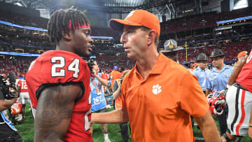 Aug 31, 2024; Atlanta, Georgia, USA; Clemson Tigers head coach Dabo Swinney greets Georgia Bulldogs defensive back Malkai Starks (24) after the 2024 Aflac Kickoff Game at Mercedes-Benz Stadium.