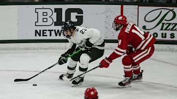 MSU's Shane Vansaghi moves the puck against Wisconsin, Thursday, Jan. 2, 2024, at Munn Ice Arena. MSU won 4-3.