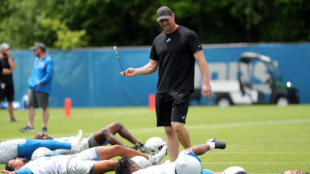 Detroit Lions head coach Dan Campbell watches players stretch during OTA practice Thursday, June 3, 2021, at the Allen Park practice facility.