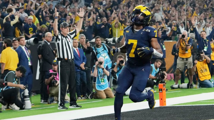 Michigan running back Donovan Edwards runs the ball in for a touchdown in the second quarter during the College Football Playoff national championship game against Washington at NRG Stadium in Houston, Texas on Monday, Jan. 8, 2024.