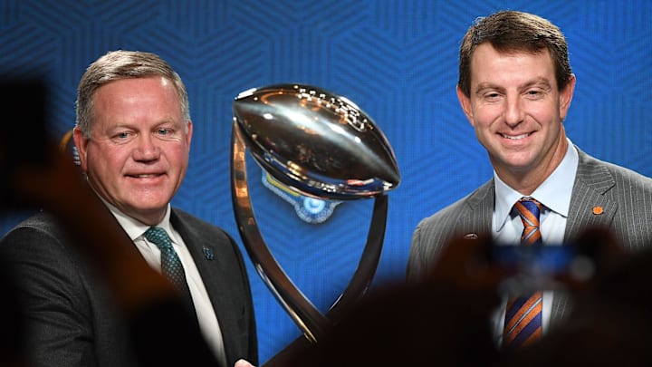 Notre Dame head coach Brian Kelly and Clemson head coach Dabo Swinney shake hands in front of the Cotton Bowl trophy after the head coaches press conference Friday, December 28, 2018.

Cotton Bowl Head Coaches Press Conference