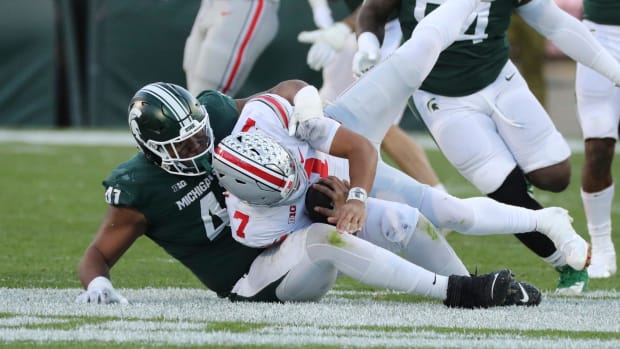 Michigan State Spartans defensive tackle Derrick Harmon (41) sacks Ohio State Buckeyes quarterback